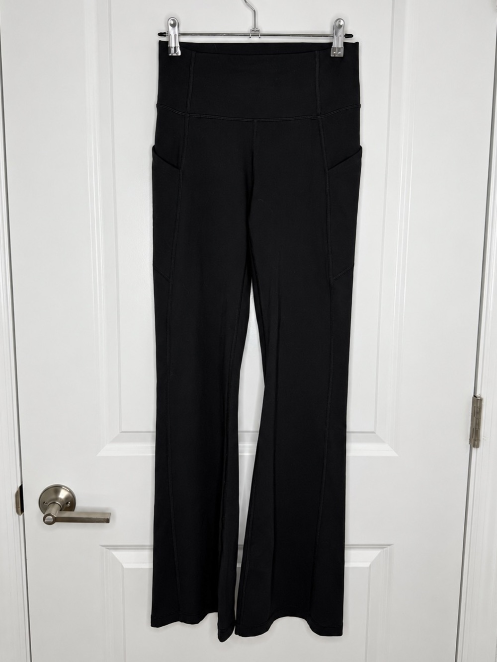 Fabletics Black High Waisted Flare Leggings Side Pockets. Size small.